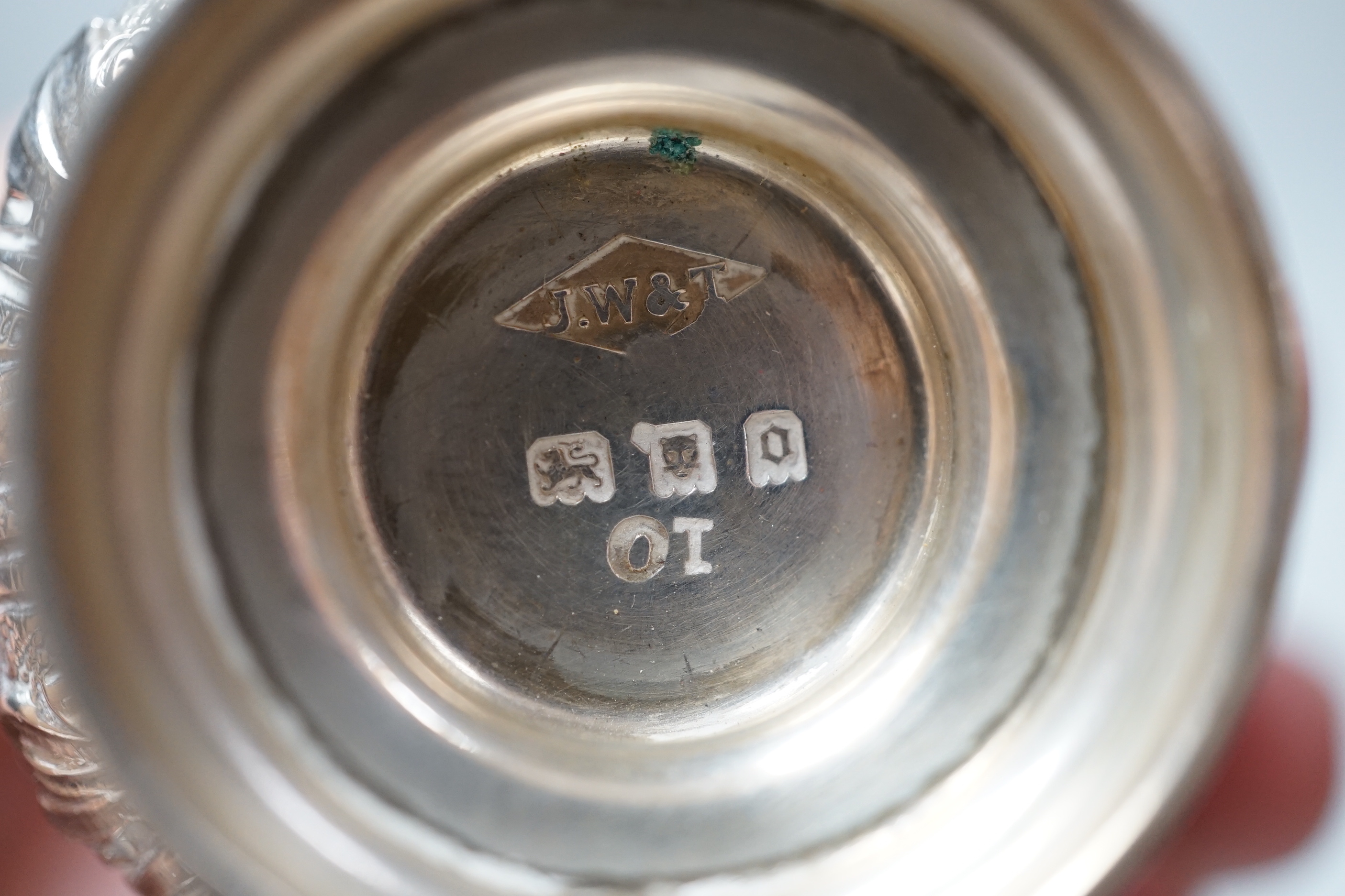 A small George V silver twin handled cup and cover, London, 1929 and three silver mounted brushes.